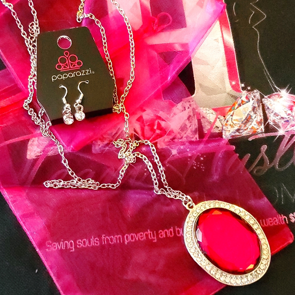 Long necklace will large jewel with matching earrings.  💕